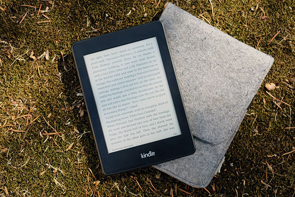 kindle and case on grass